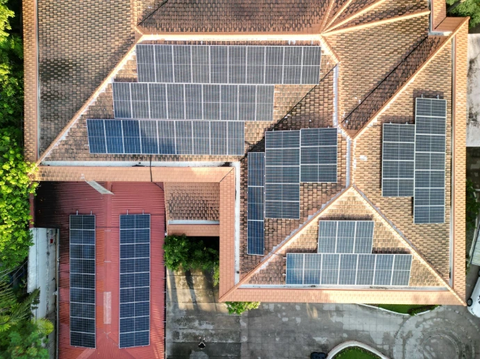 50kWp Hybrid Makati Residential Aerial view of a 50 kWp hybrid solar array on a residential roof in Makati City